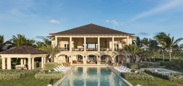 Palm trees, private pool, and beautiful archways at an Inspirato luxury villa in Punta Cana, Dominican Republic